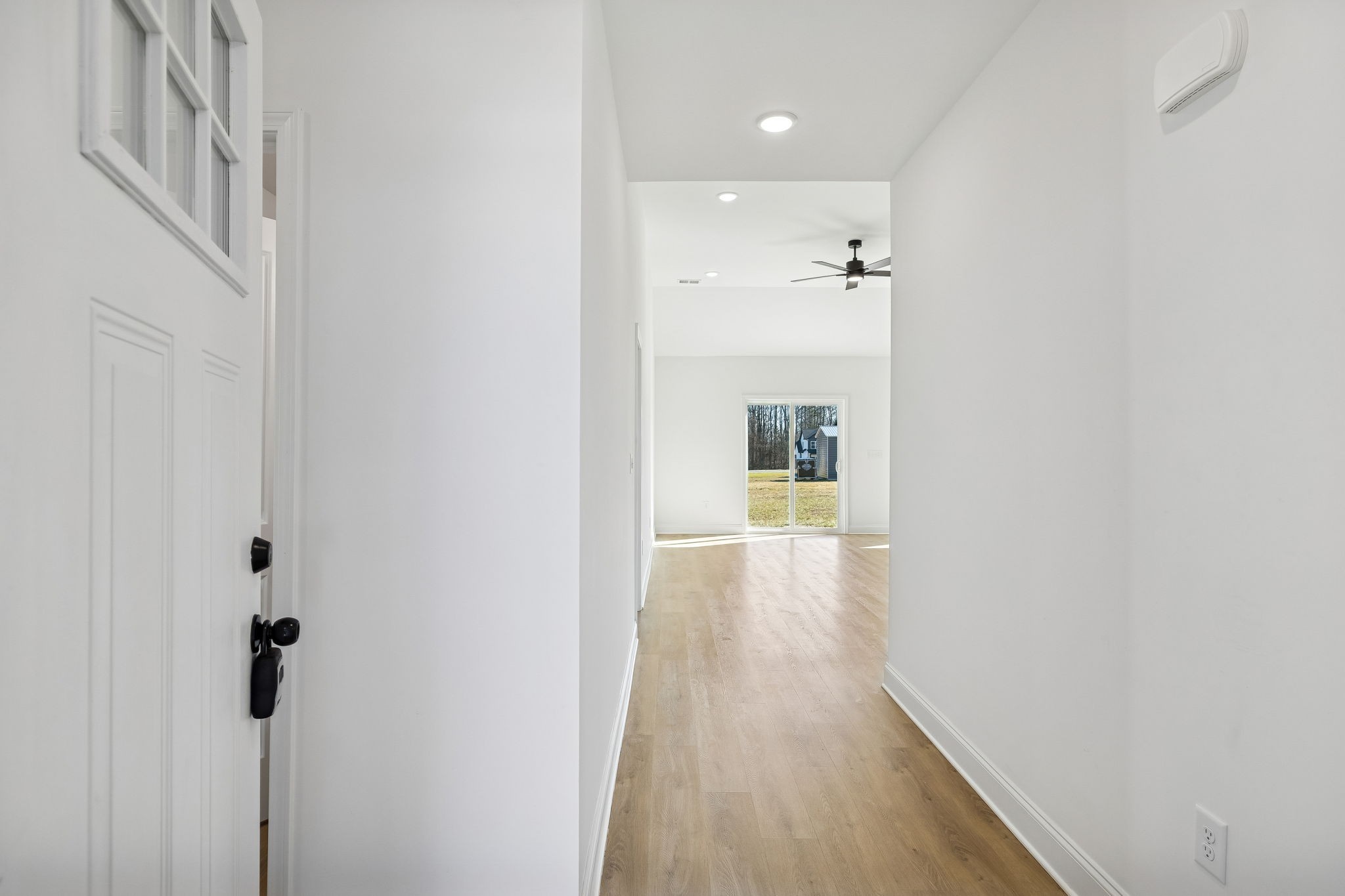 1306 Angus Way Greenbrier, TN 37073 - Photo 7 of 36 a view of a hallway with wooden floor and a bathroom