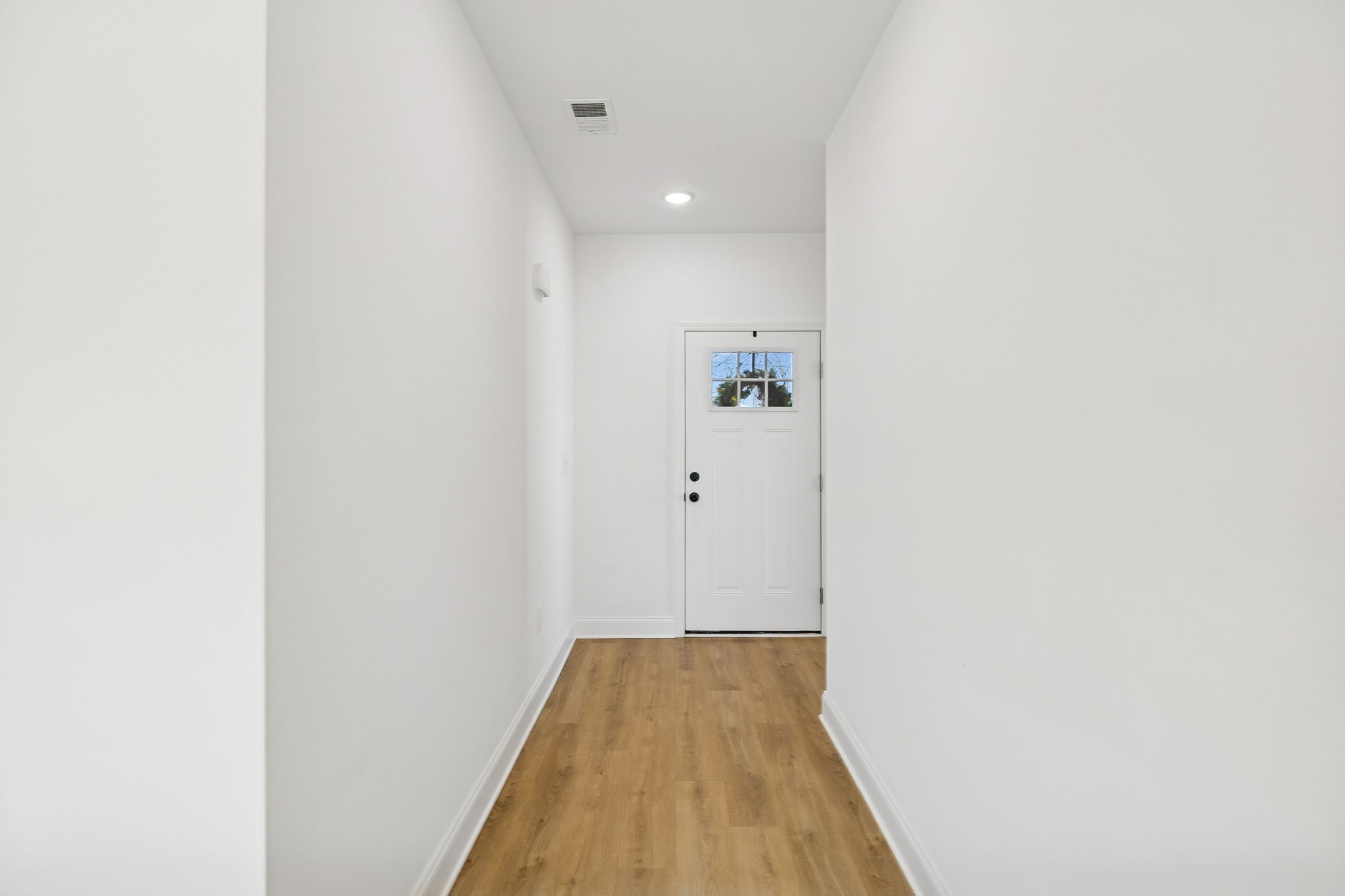 1306 Angus Way Greenbrier, TN 37073 - Photo 8 of 36 a view of a hallway with wooden floor