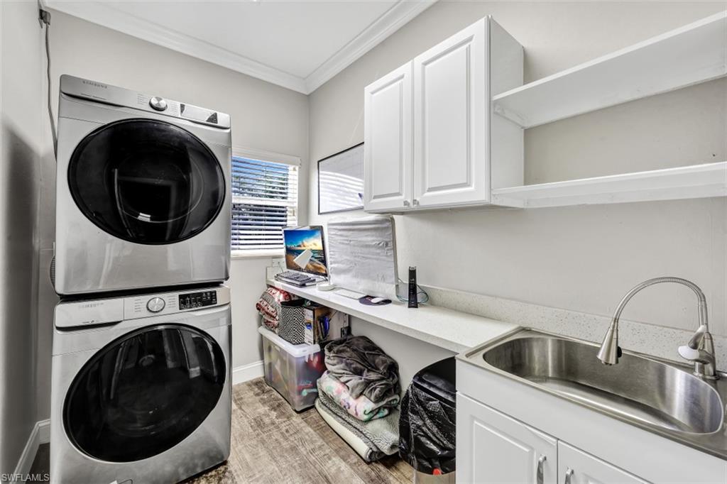 2875 Garland Road Naples, FL 34117 - Photo 19 of 34 a utility room with sink dryer and washer