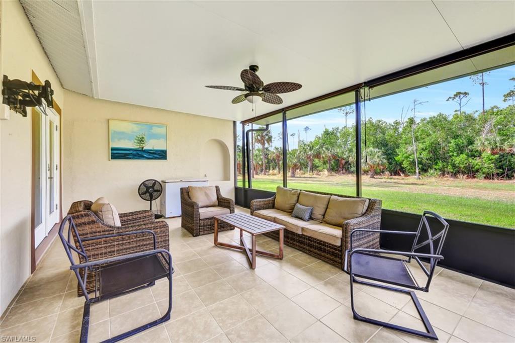 2875 Garland Road Naples, FL 34117 - Photo 20 of 34 a living room with furniture and a large window