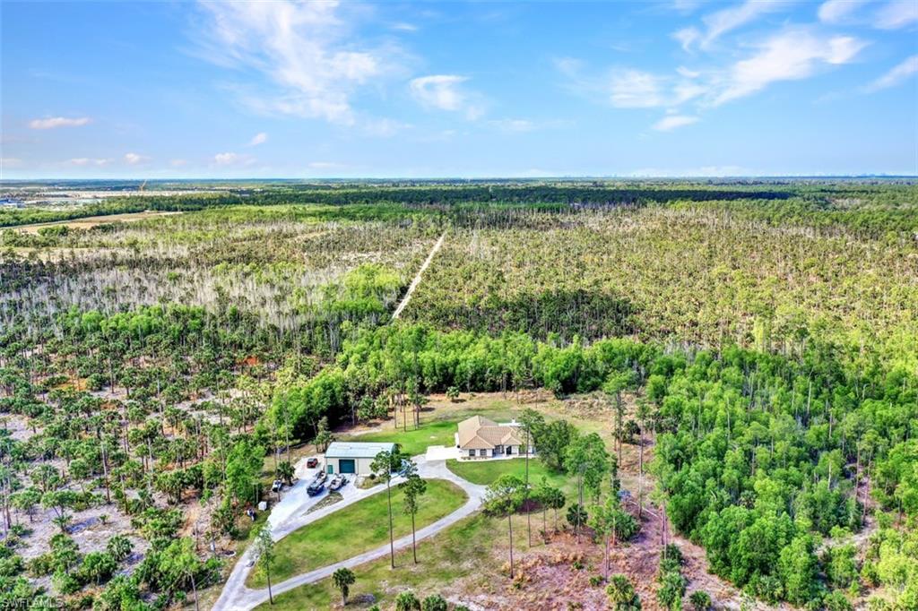 2875 Garland Road Naples, FL 34117 - Photo 26 of 34 a view of an outdoor space and a yard
