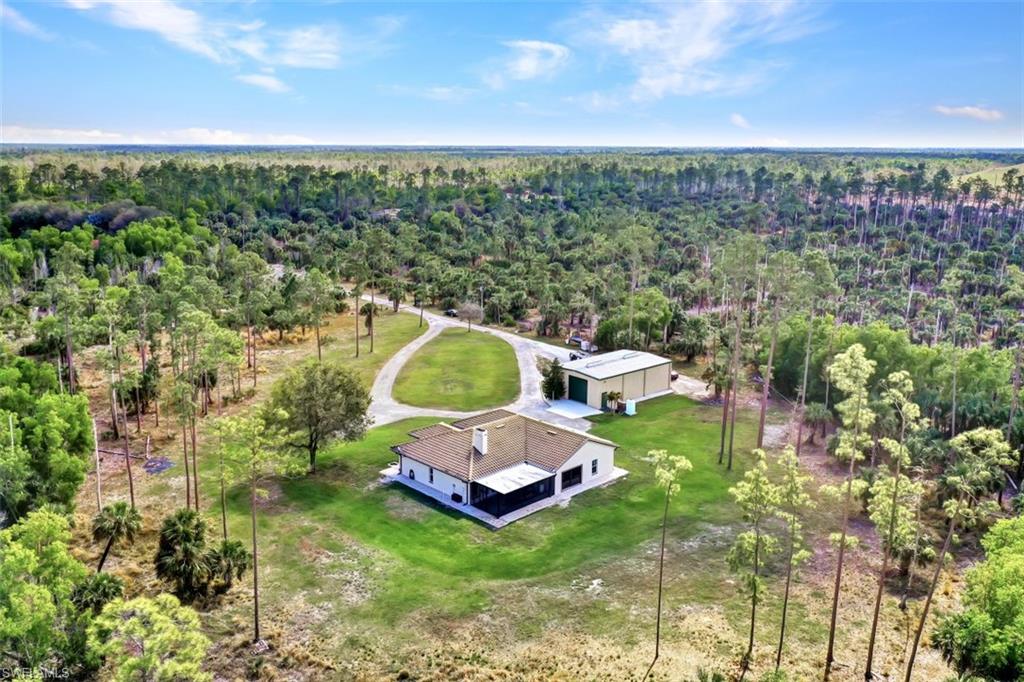 2875 Garland Road Naples, FL 34117 - Photo 30 of 34 a view of a house with a yard