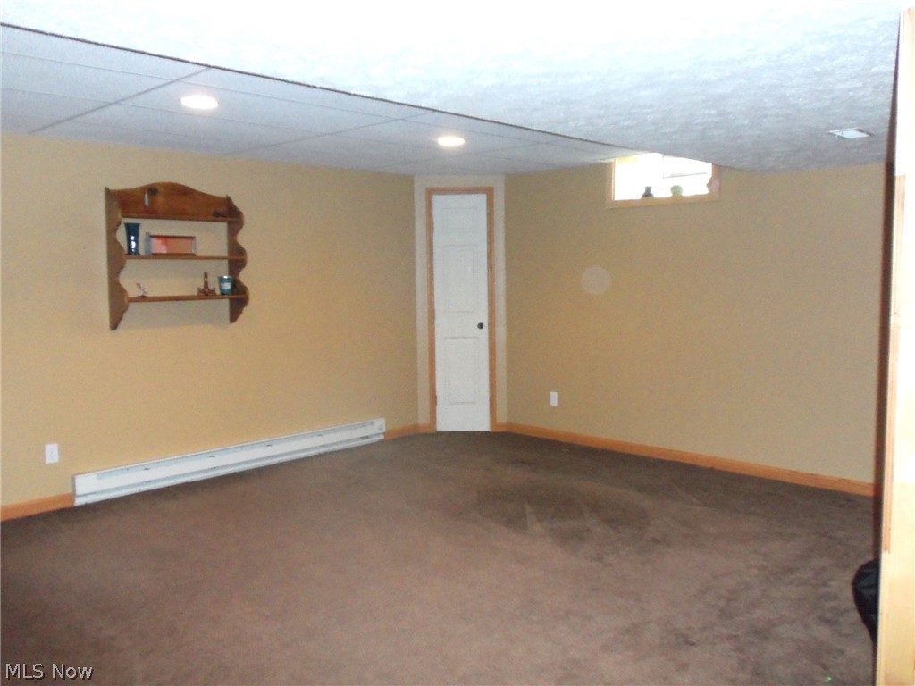 17506 Madison Road Middlefield, OH 44062 - Photo 22 of 35 Lower level Rec. room area has roughed in kitchen area
