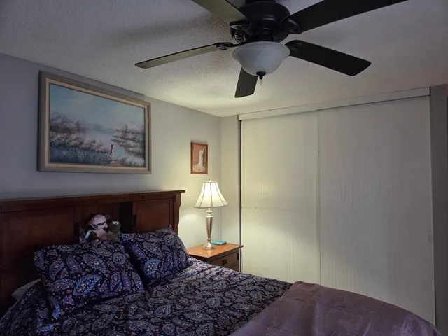 a bed in a room next to a window