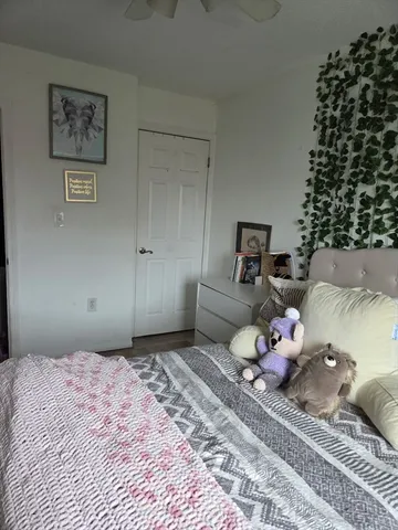 a bedroom with a bed and a couch