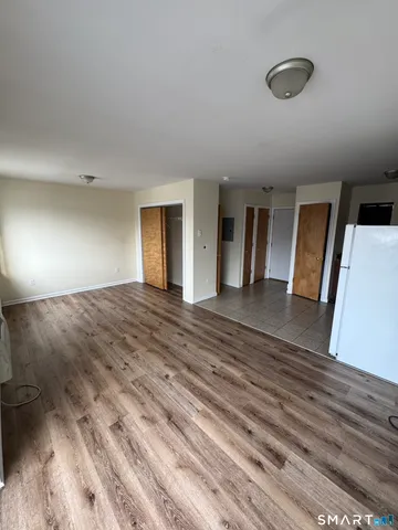 a view of a livingroom with wooden floor