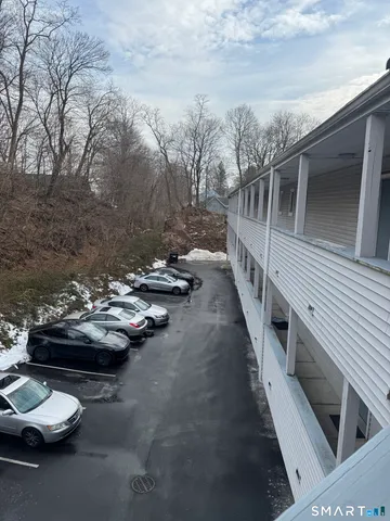 a view of a street with cars on road
