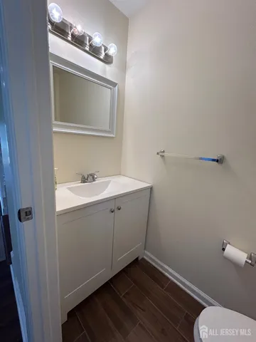a bathroom with a sink mirror and vanity