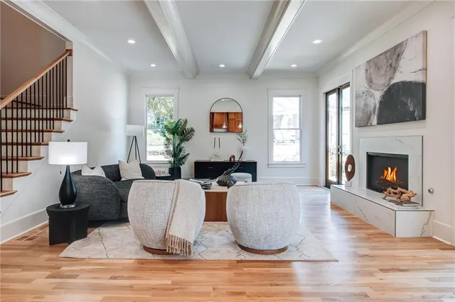 a living room with furniture and a fireplace