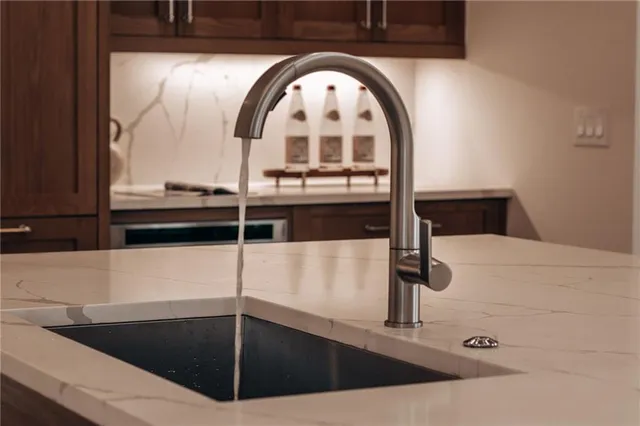 a dining room with furniture and a potted plant