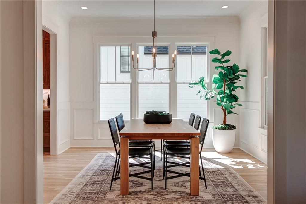 585 Sherwood Road Northeast Atlanta, GA 30324 - Photo 14 of 104 a view of a dining room with furniture window and wooden floor