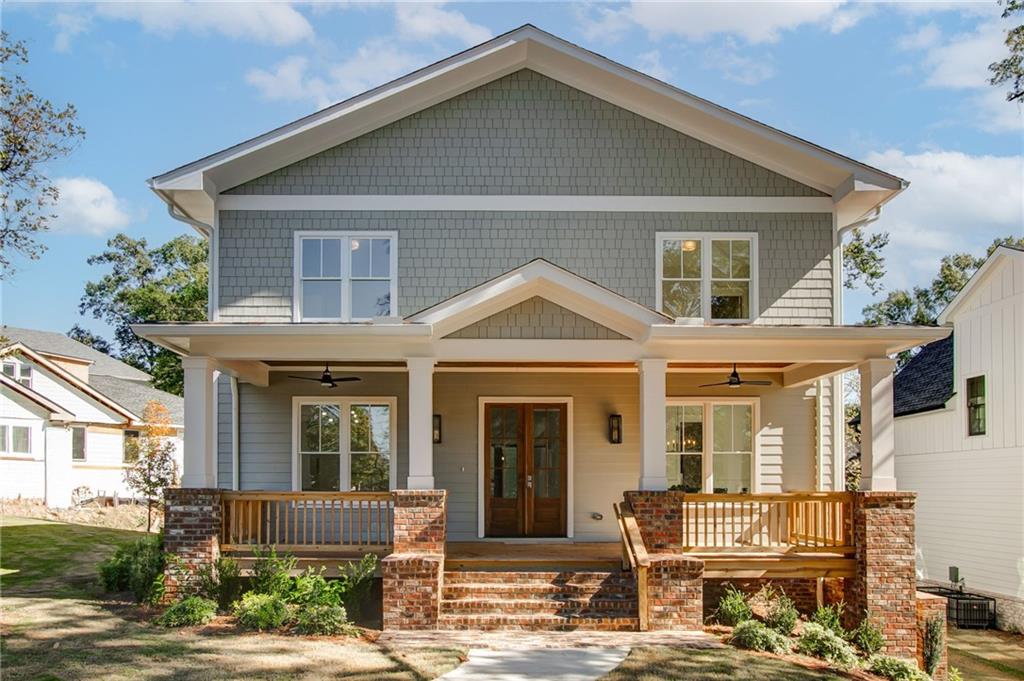 585 Sherwood Road Northeast Atlanta, GA 30324 - Photo 2 of 104 a front view of a house with a yard