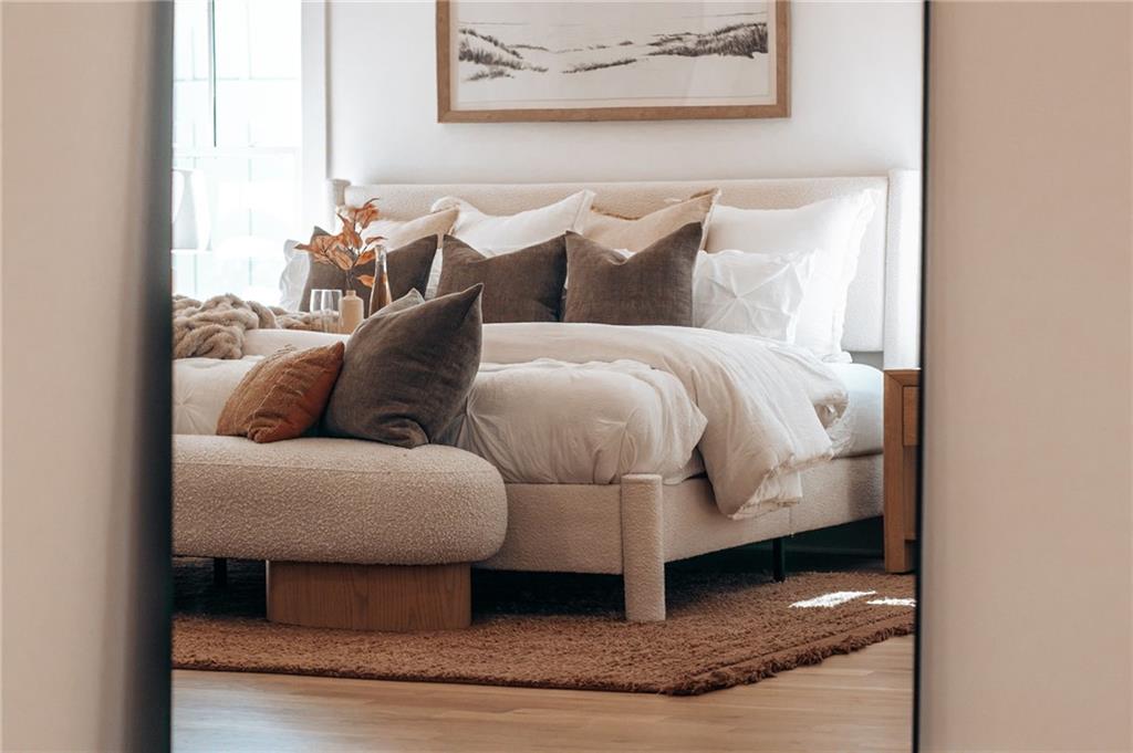 585 Sherwood Road Northeast Atlanta, GA 30324 - Photo 21 of 104 a bedroom with a bed and a painting on the wall