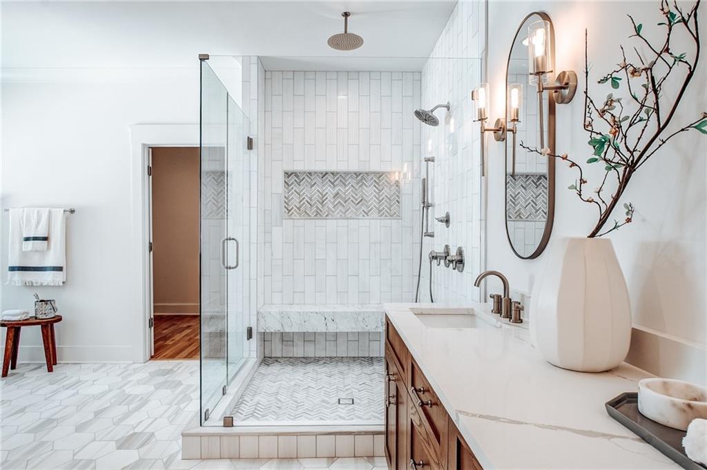 585 Sherwood Road Northeast Atlanta, GA 30324 - Photo 24 of 104 a bathroom with a granite countertop sink and a mirror