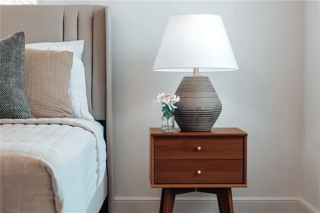 a bathroom with a toilet sink vanity tub and mirror