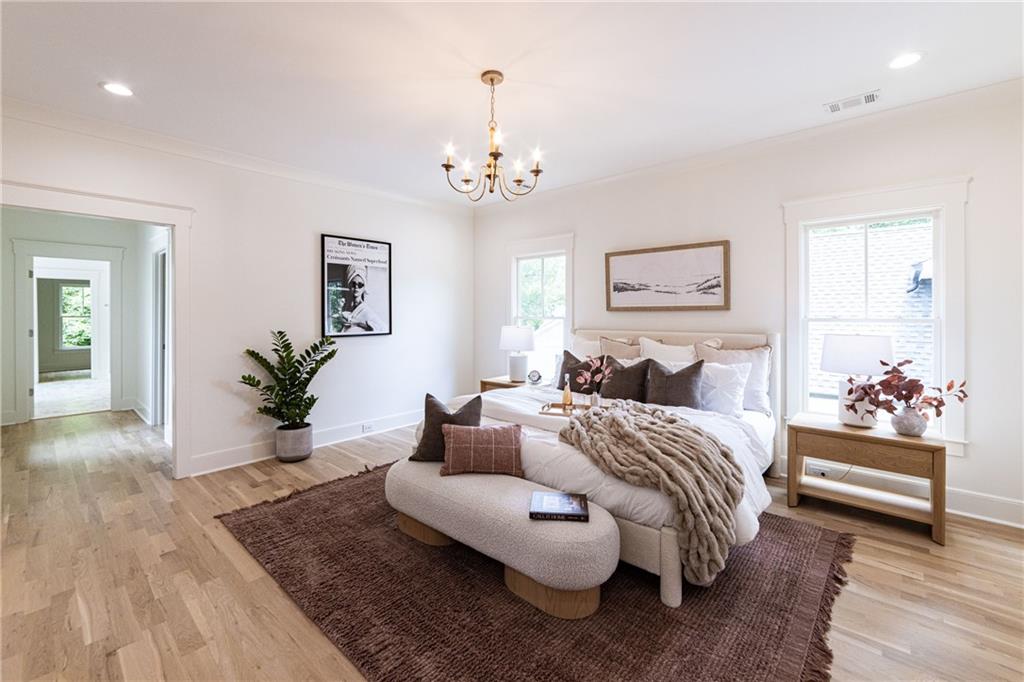 585 Sherwood Road Northeast Atlanta, GA 30324 - Photo 35 of 104 a bedroom with bed and a couch