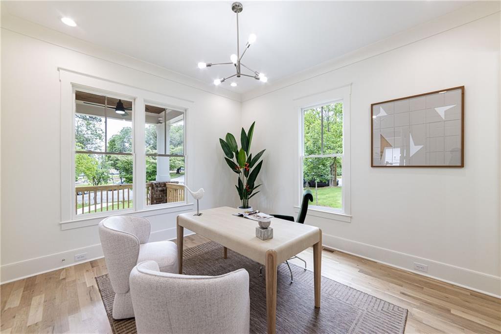 585 Sherwood Road Northeast Atlanta, GA 30324 - Photo 40 of 104 a living room with furniture a potted plant and a window