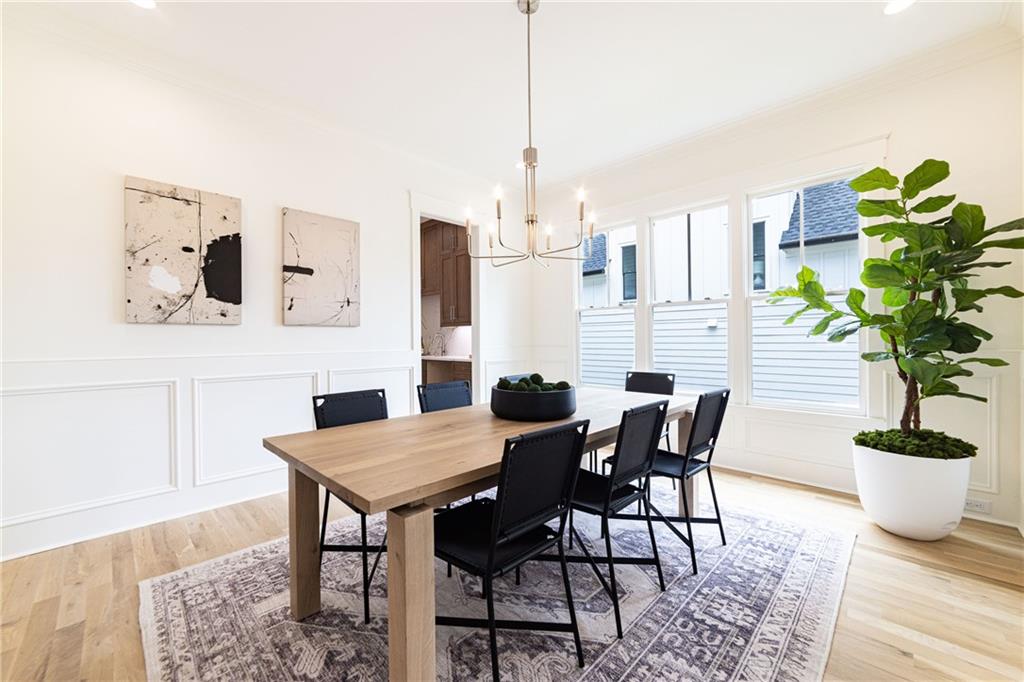 585 Sherwood Road Northeast Atlanta, GA 30324 - Photo 41 of 104 a view of a dining room with furniture and a potted plant