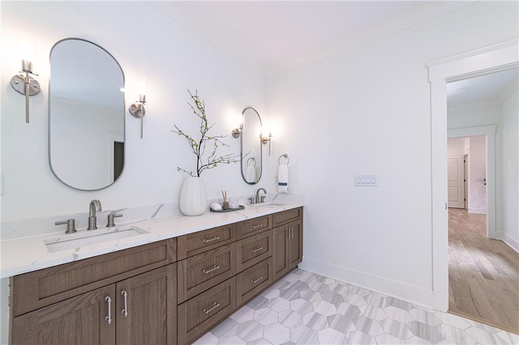 585 Sherwood Road Northeast Atlanta, GA 30324 - Photo 50 of 104 a bathroom with a double vanity sink and a mirror