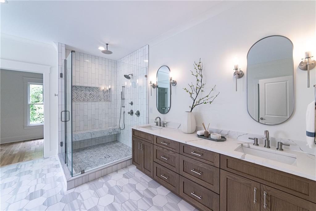 585 Sherwood Road Northeast Atlanta, GA 30324 - Photo 51 of 104 a bathroom with a double vanity sink mirror double and shower