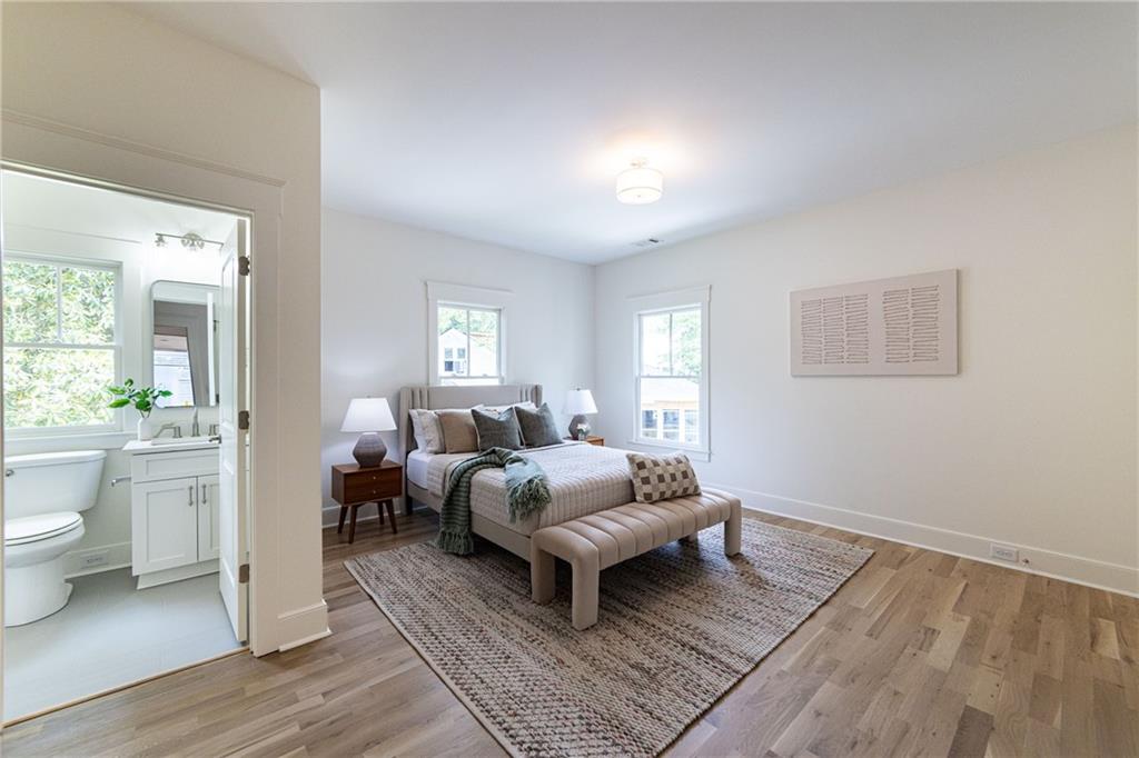 585 Sherwood Road Northeast Atlanta, GA 30324 - Photo 52 of 104 a living room with furniture a flat screen tv and a large window