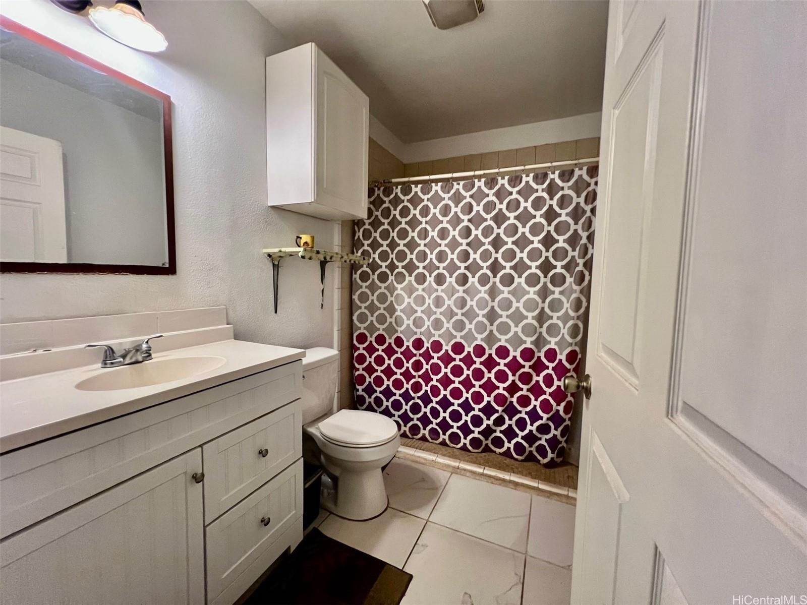 87-159 Maipela Street Waianae, HI 96792 - Photo 8 of 9 a bathroom with a sink a toilet and shower