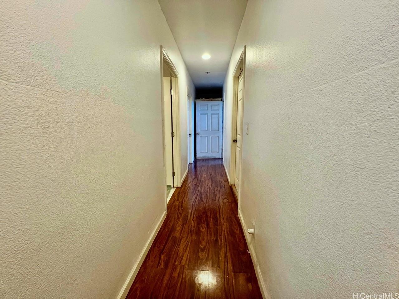 87-159 Maipela Street Waianae, HI 96792 - Photo 9 of 9 a view of a hallway with wooden floor