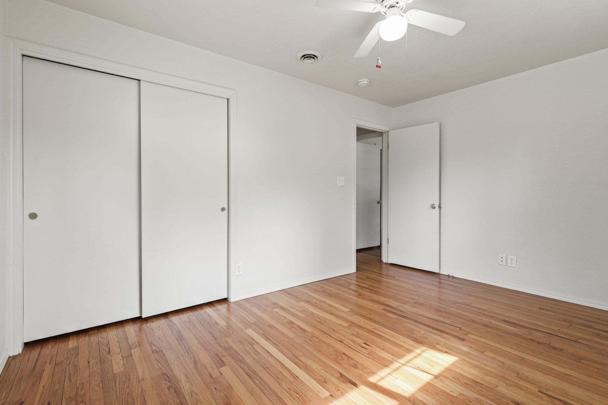3581 Echo Road Redding, CA 96002 - Photo 13 of 19 a view of an empty room with wooden floor
