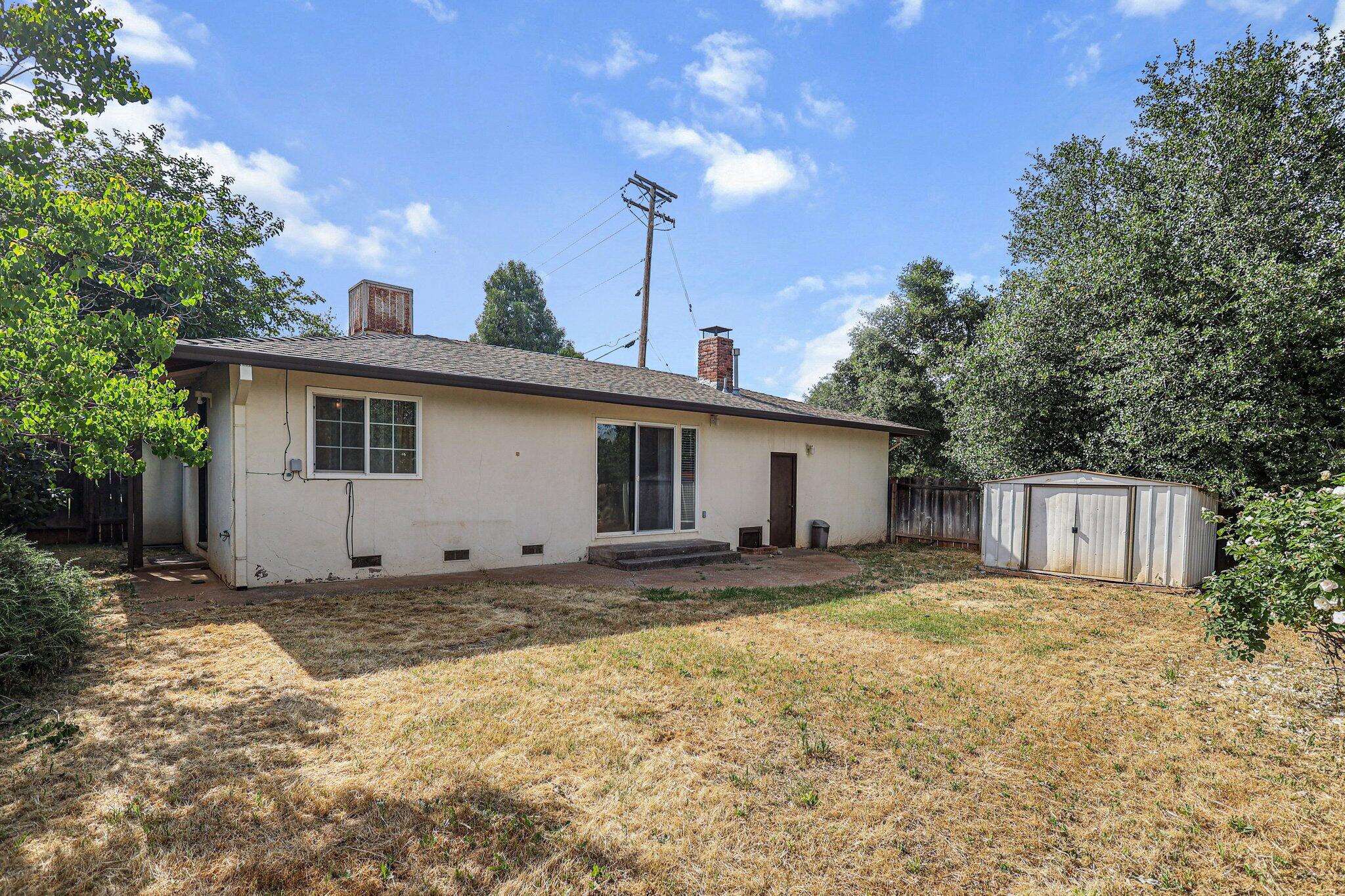 3581 Echo Road Redding, CA 96002 - Photo 15 of 19 a view of a house with a yard and tree
