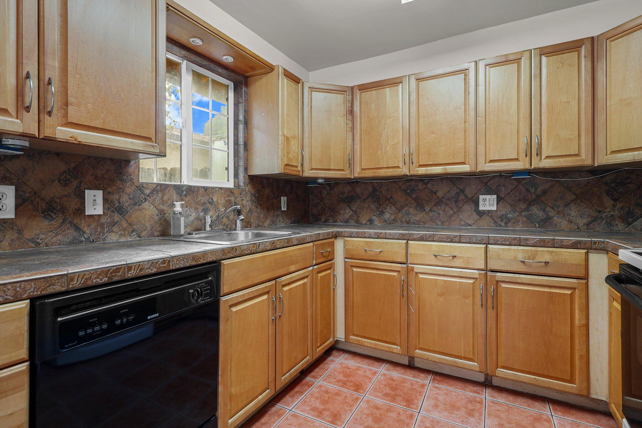 3581 Echo Road Redding, CA 96002 - Photo 3 of 19 a kitchen with granite countertop cabinets stainless steel appliances a sink and a window