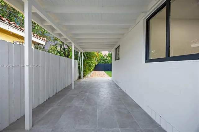 an aerial view of houses with yard