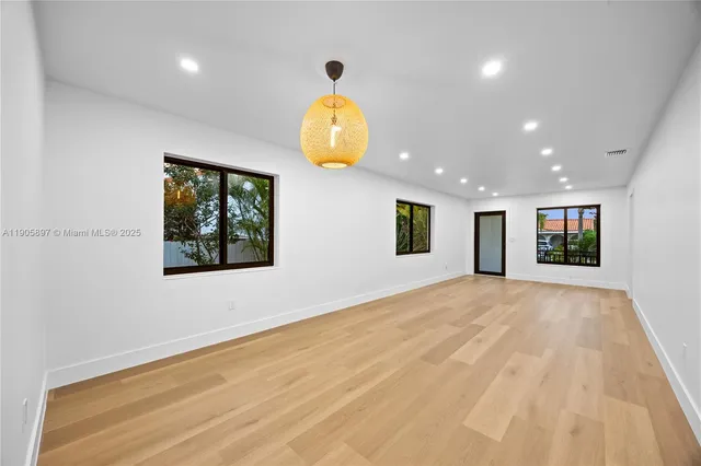 a kitchen that has a sink and a stove in it