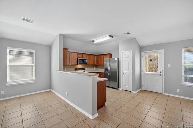 a view of a kitchen and utility room