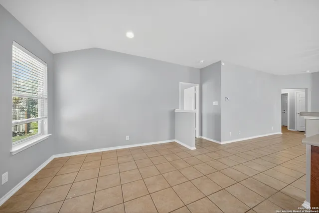 a view of an empty room and window