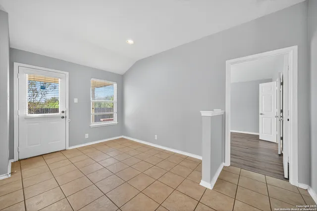 a view of an empty room and window