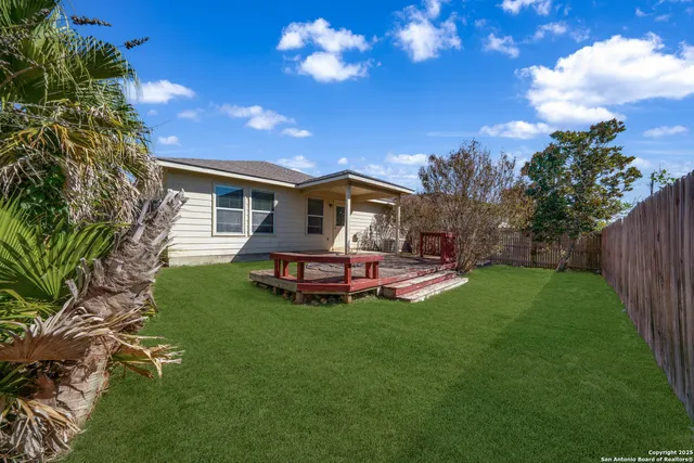 a view of a house with a yard porch and sitting area