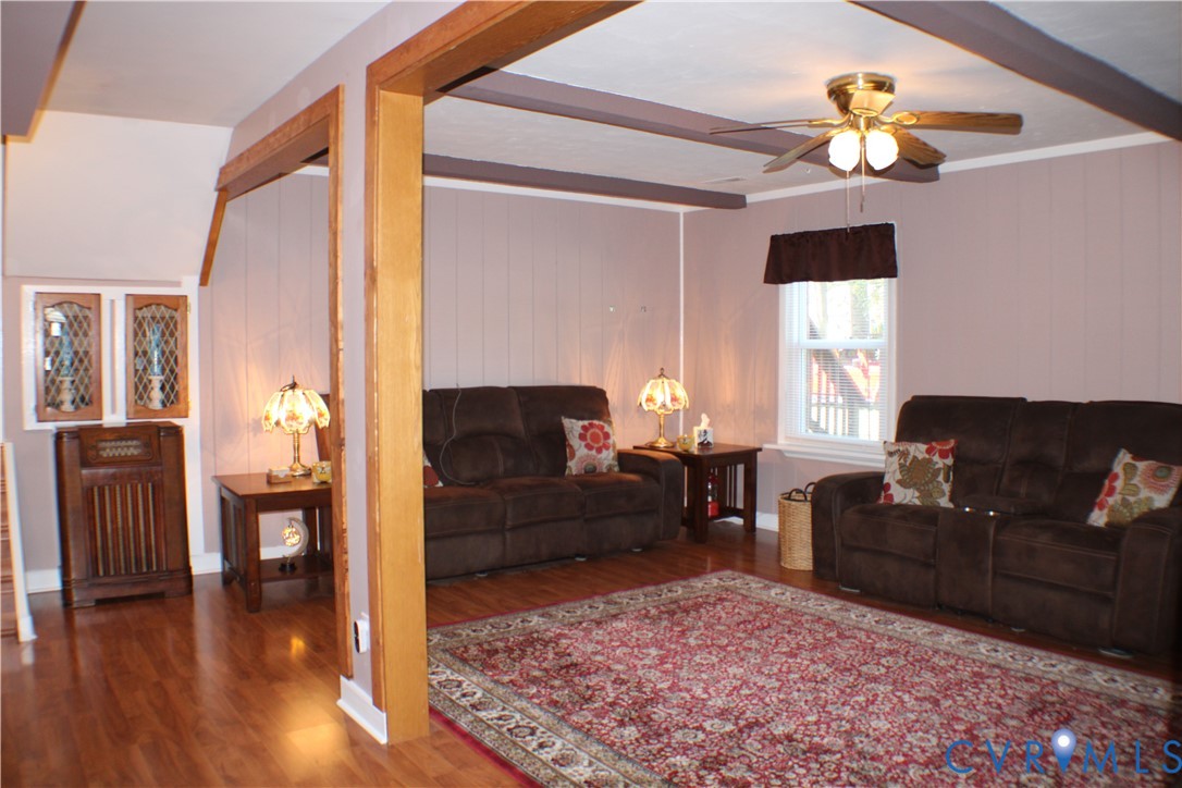 10009 Simplicity Street Chesterfield, VA 23832 - Photo 11 of 47 a living room with furniture and wooden floor