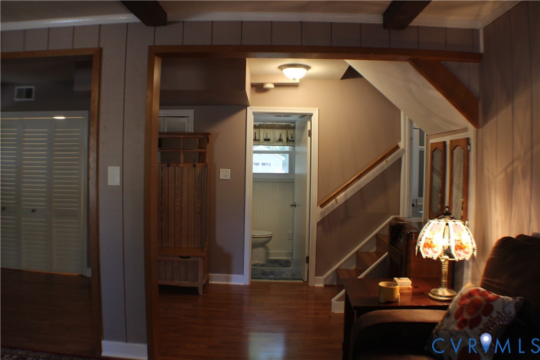 10009 Simplicity Street Chesterfield, VA 23832 - Photo 13 of 47 a room with wooden floor and furniture