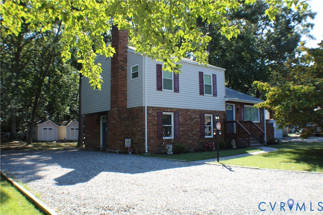 10009 Simplicity Street Chesterfield, VA 23832 - Photo 2 of 47 a front view of a house with a yard