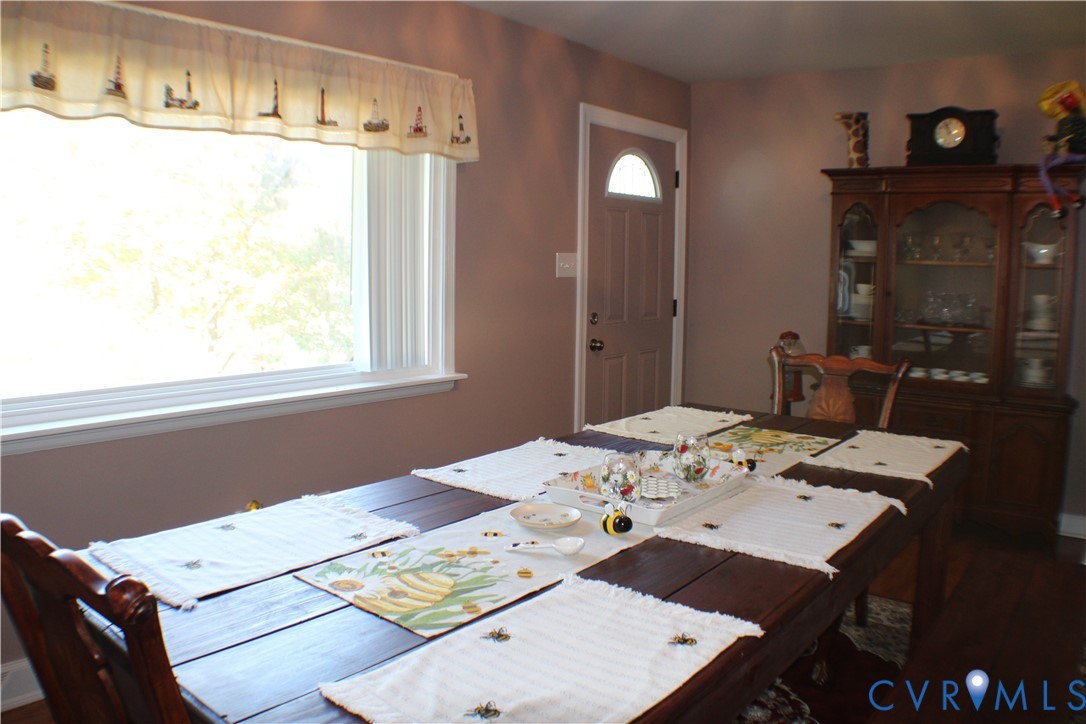 10009 Simplicity Street Chesterfield, VA 23832 - Photo 24 of 47 a view of a dining table and chairs in a room