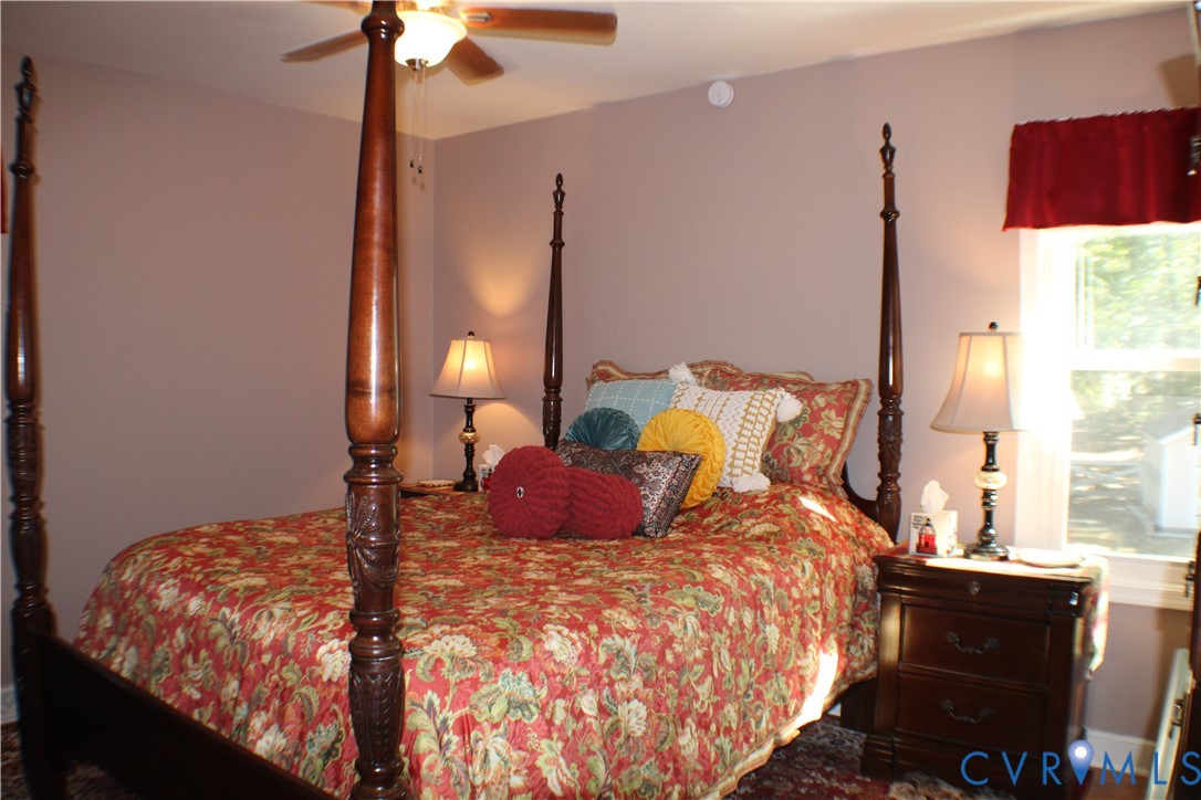 10009 Simplicity Street Chesterfield, VA 23832 - Photo 26 of 47 a bedroom with a bed and window