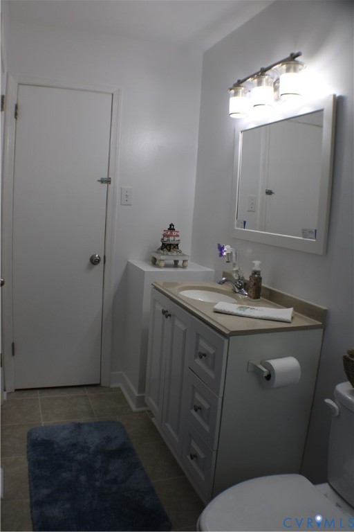 10009 Simplicity Street Chesterfield, VA 23832 - Photo 28 of 47 a bathroom with a sink toilet and shower