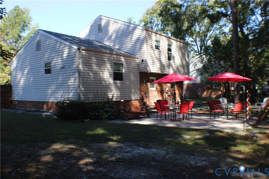10009 Simplicity Street Chesterfield, VA 23832 - Photo 3 of 47 a front view of a house with an outdoor seating