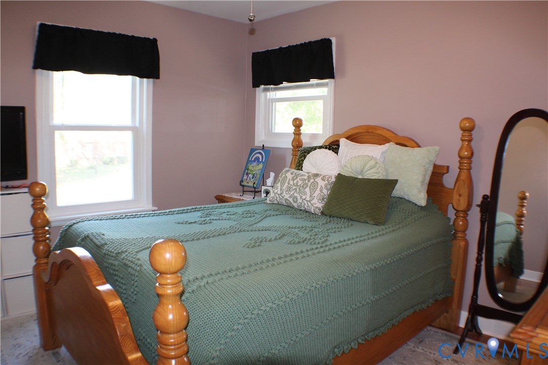 10009 Simplicity Street Chesterfield, VA 23832 - Photo 31 of 47 a bedroom with a bed and a window