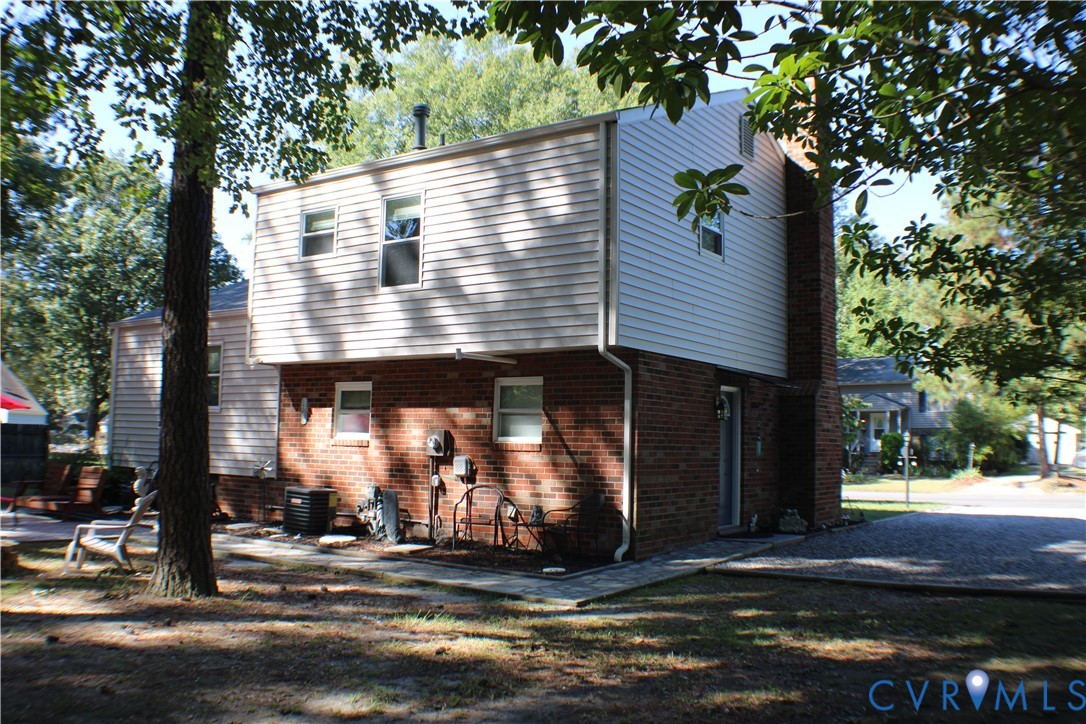 10009 Simplicity Street Chesterfield, VA 23832 - Photo 34 of 47 a front view of a house with a yard