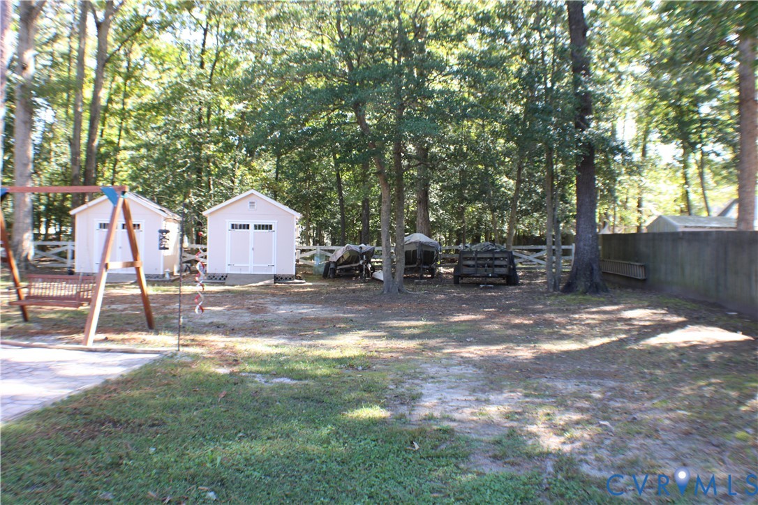 10009 Simplicity Street Chesterfield, VA 23832 - Photo 4 of 47 a backyard of a house with table and chairs