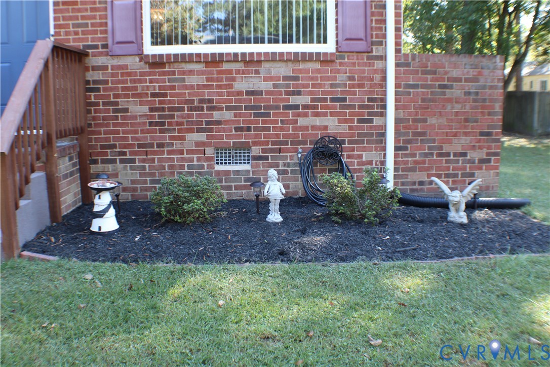 10009 Simplicity Street Chesterfield, VA 23832 - Photo 5 of 47 a view of a backyard with plants and a fountain