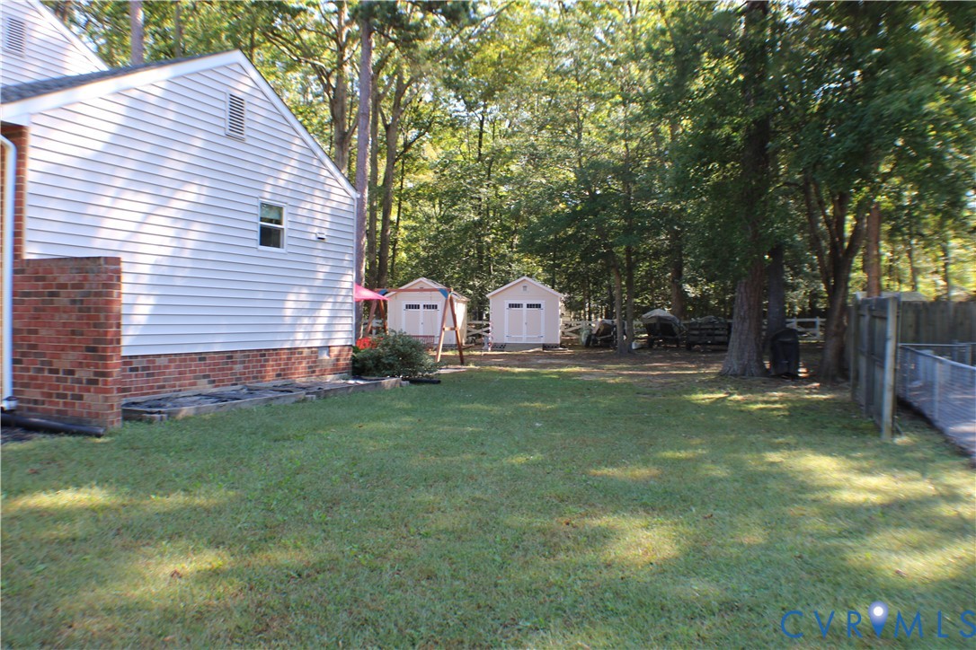 10009 Simplicity Street Chesterfield, VA 23832 - Photo 7 of 47 a view of backyard with table and chairs and a tree