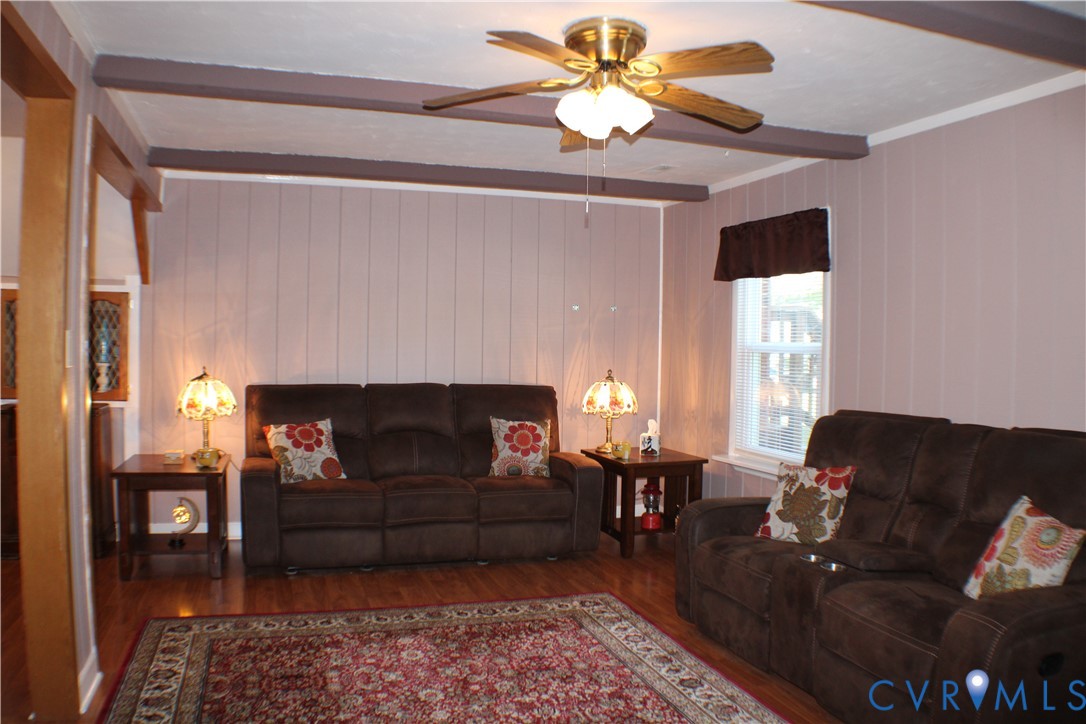 10009 Simplicity Street Chesterfield, VA 23832 - Photo 8 of 47 a living room with furniture and a fireplace