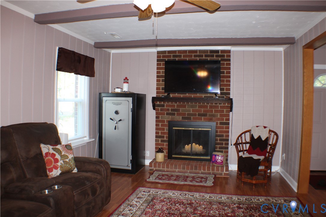 10009 Simplicity Street Chesterfield, VA 23832 - Photo 10 of 47 a living room with furniture and a fireplace